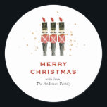 Festive Red & Gold Nutcracker Christmas Classic Round Sticker<br><div class="desc">Add a touch of holiday cheer to your packages, letters, and gifts with our stunning Merry Christmas Classic Round Stickers! Featuring a hand-painted watercolor design of timeless red and gold nutcrackers, complete with faux gold glitter accents. Easily personalize with our customizable template for a unique touch. Perfect for special mailings,...</div>