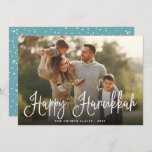 Festive Script Overlay Hanukkah Photo Holiday Card<br><div class="desc">Simple and chic Hanukkah photo card features your favorite family photo overlaid with "Happy Hanukkah" in white modern script lettering. Personalize with your family name and the year along the bottom. Cards reverse to a snow and stars pattern in festive teal and white.</div>