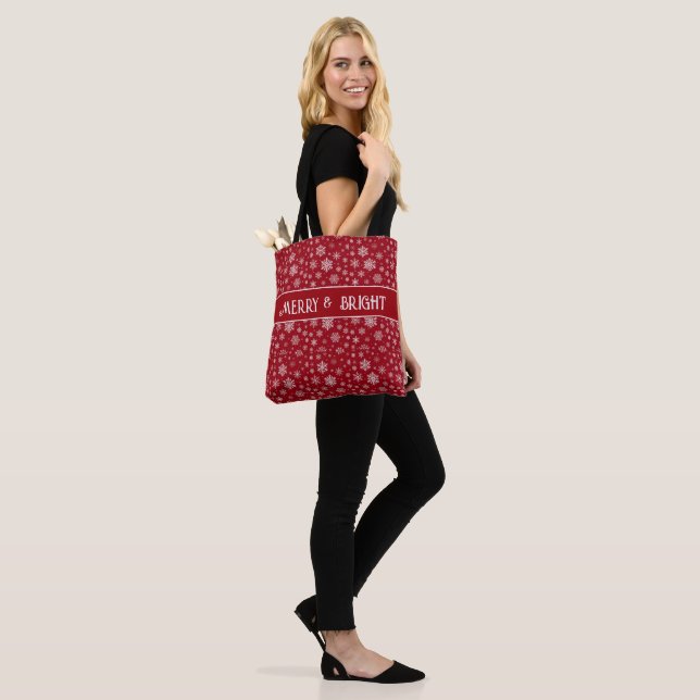 Festive Snowflake Tote Bag on Red (On Model)