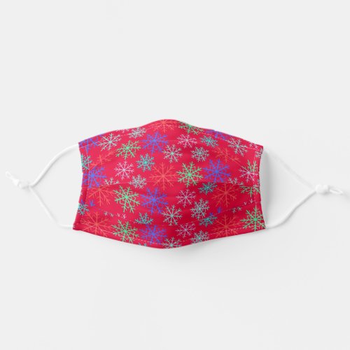 festive snowflakes on red adult cloth face mask