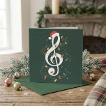 Festive Treble Clef Santa Hat Christmas Lights Holiday Card<br><div class="desc">Festive Treble Clef Santa Hat Christmas Lights Music Art features a white treble clef topped with a Santa hat and wrapped in colorful holiday lights. Tiny musical notes and gold swirls add movement and a cheerful seasonal feel. The dark green background gives the design a rich festive look. It is...</div>