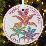 Festive Tropical Palm Trees Christmas Glass Ornament<br><div class="desc">Celebrate the season with this festive tropical palm trees Christmas ornament that brings a vibrant twist to your decor. Featuring a colorful palm trees illustration in pink, orange, blue, green, and purple hues with pink script text, this design captures the joy of a tropical holiday. Perfect for holiday decorators or...</div>