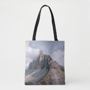 FIELD AND MOUNTAIN VIEW UNDER WHITE AND BLUE SKY TOTE BAG