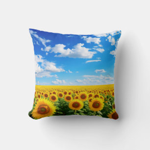 Field of sunflowers under blue sky, vibrant summer throw pillow