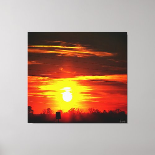 Fiery Sunset Over Trees Canvas Print