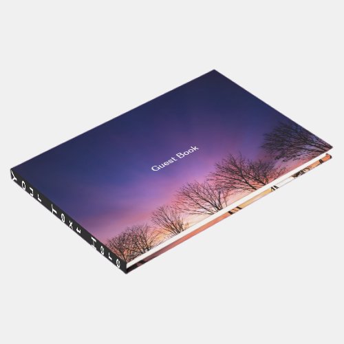 Fiery winter sunset with bare trees guest book