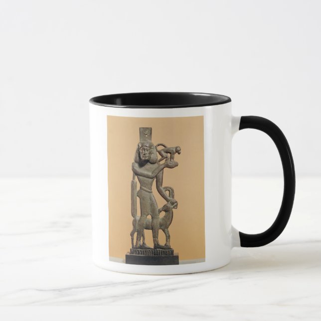 Figure of a man holding a monkey mug (Right)