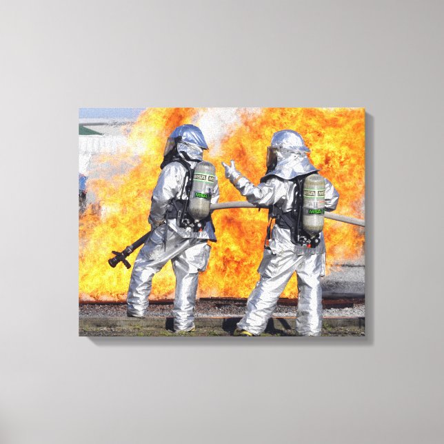 Firefighters battle a simulated fire canvas print (Front)