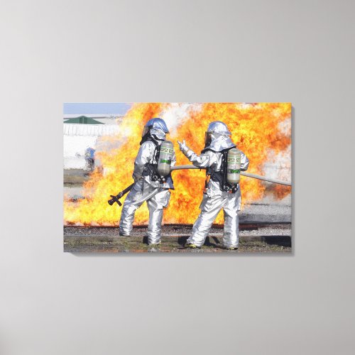 Firefighters battle a simulated fire canvas print