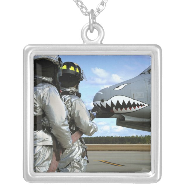 Firefighters deploy a fire hose during a drill silver plated necklace (Front)