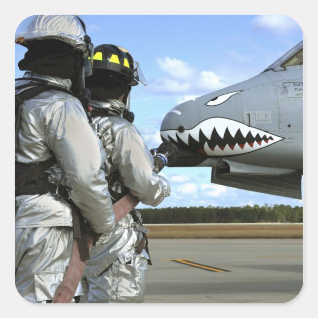 Firefighters deploy a fire hose during a drill square sticker (Front)