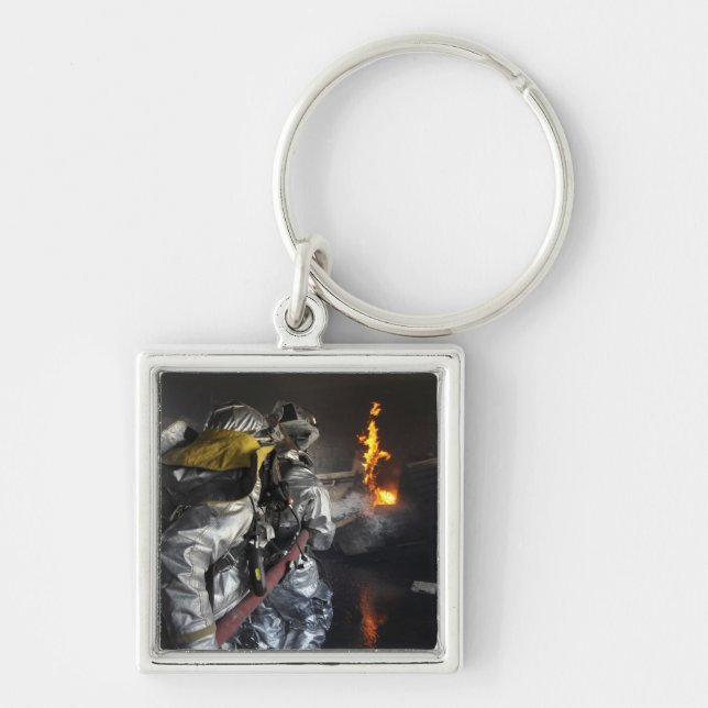 Firefighters extinguish a fire in a training ro keychain (Front)