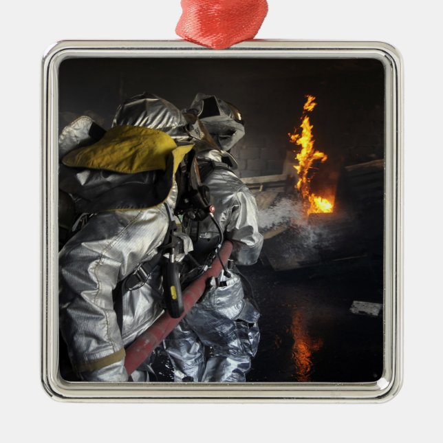 Firefighters extinguish a fire in a training ro metal ornament (Front)