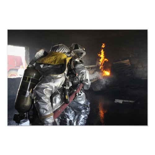 Firefighters extinguish a fire in a training ro photo print