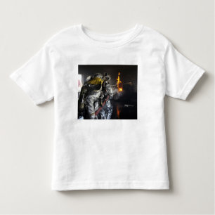 Firefighters extinguish a fire in a training ro toddler t-shirt