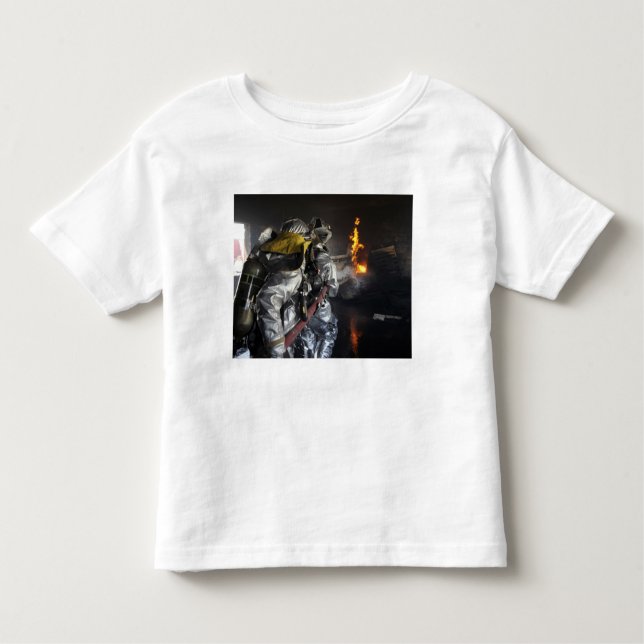 Firefighters extinguish a fire in a training ro toddler t-shirt (Front)