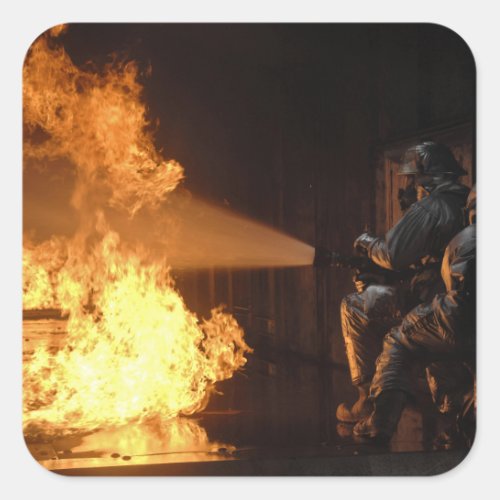 Firefighters extinguish a simulated battery fir square sticker