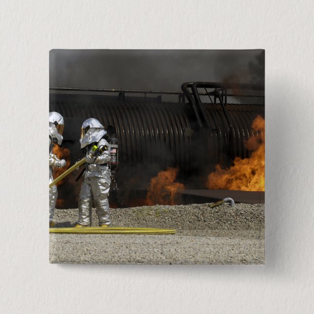 Firefighters neutralize a live fire button (Front)