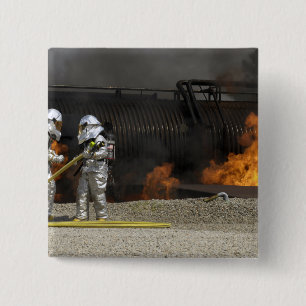 Firefighters neutralize a live fire button