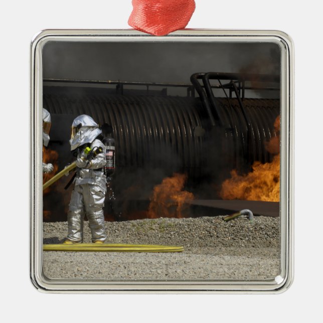 Firefighters neutralize a live fire metal ornament (Front)