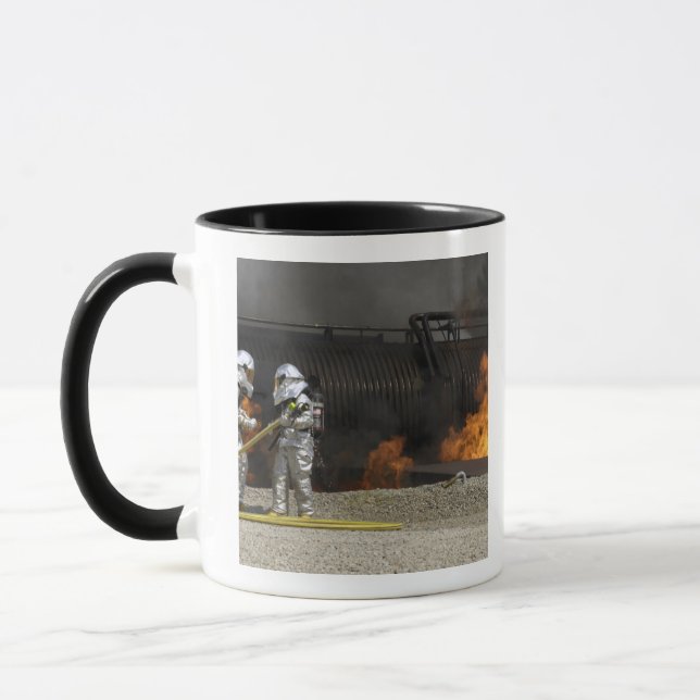 Firefighters neutralize a live fire mug (Left)