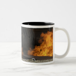 Firefighters neutralize a live fire Two-Tone coffee mug