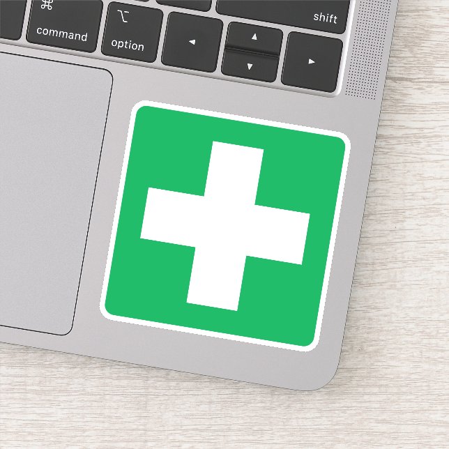 First aid symbol stickers, white cross on green sticker (Detail)