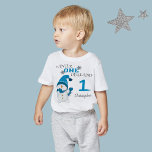 First Birthday Winter Onderland Snowman Boy  Baby T-Shirt<br><div class="desc">Winter Onederland 1st first birthday party,  holiday Christmas Winter T-shirt. Cute Little Snowman with blue beanie and scarf. You can personalize this adorable t-shirt with your child's name.</div>