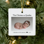 First Christmas as Grandma New Baby Photo Ceramic Ornament<br><div class="desc">Celebrate her first Christmas as grandma with this personalized photo Christmas tree ornament.  All text can be customized.  Add your own photo to create a truly unique gift for her first Christmas as a grandma.</div>