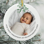 First Christmas As Grandparents Photo Mistletoe Ceramic Ornament<br><div class="desc">This Grandparent's First Christmas Ornament is decorated with watercolor mistletoe.
Easily customizable with your baby's photo,  name,  and year.
Use the Design Tool to change the text size,  style,  or color.
Because we create our artwork you won't find this exact image from other designers.
Original Watercolor © Michele Davies.</div>