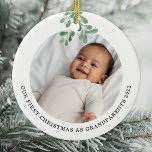 First Christmas As Grandparents Photo Mistletoe Ceramic Ornament<br><div class="desc">This Grandparent's First Christmas Ornament is decorated with watercolor mistletoe.
Easily customizable with your baby's photo,  name,  and year.
Use the Design Tool to change the text size,  style,  or color.
Because we create our artwork you won't find this exact image from other designers.
Original Watercolor © Michele Davies.</div>