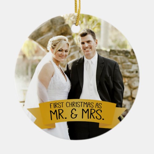 First Christmas as Mr. & Mrs. Photo Ceramic Gold Ceramic Ornament - This photo Christmas tree ornament features photo frame to fill the front of the ornament. A graphic of a gold ribbon banner, near the bottom, features the text: First Christmas as Mr. & Mrs. Custom text, on the back, allows you to add the names of the bride and groom and the year, This ornament is a perfect Christmas gift for the newlyweds.