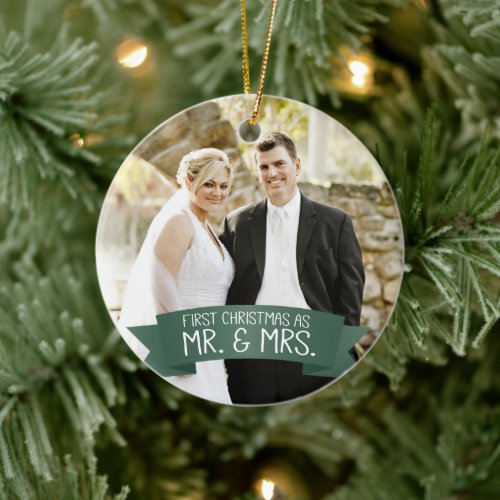 First Christmas as Mr. & Mrs. Photo Dark Green Ceramic Ornament - This photo Christmas tree ornament features photo frame to fill the front of the ornament. A graphic of a dark green ribbon banner, near the bottom, features the text: First Christmas as Mr. & Mrs. Custom text, on the back, allows you to add the names of the bride and groom and the year. This ornament is a perfect Christmas gift for the newlyweds.