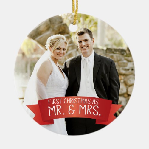 First Christmas as Mr. & Mrs. Photo Red Ceramic Ornament - This photo Christmas tree ornament features photo frame to fill the front of the ornament. A graphic of a red ribbon banner, near the bottom, features the text: First Christmas as Mr. & Mrs. Custom text, on the back, allows you to add the names of the bride and groom and the year. This ornament is a perfect Christmas gift for the newlyweds.