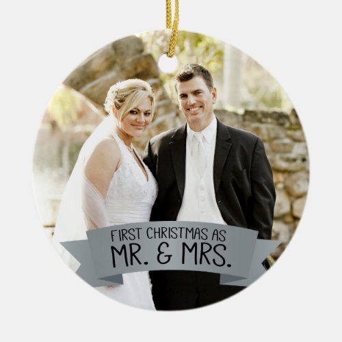 First Christmas as Mr. & Mrs. Photo Silver Gray Ceramic Ornament - This photo Christmas tree ornament features photo frame to fill the front of the ornament. A graphic of a silver gray ribbon banner, near the bottom, features the text: First Christmas as Mr. & Mrs. Custom text, on the back, allows you to add the names of the bride and groom and the year. This ornament is a perfect Christmas gift for the newlyweds.