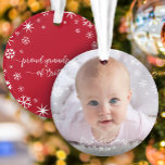 First Christmas Baby Photo Snowflakes Grandparents Ornament<br><div class="desc">“First Christmas.” A playful visual of white snowflakes and handwritten script typography with customized year, overlaying the photo of your choice, help you usher in Christmas and New Year. On the back, additional white snowflakes and handwritten typography with “proud grandparents of baby’s name” overlay a red background. Feel the warmth...</div>