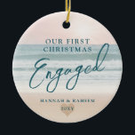 First Christmas Beach Engagement Ocean Pastel Ceramic Ornament<br><div class="desc">Keepsake Engagement Ornament a pastel pink peach and teal blue beach sunset or sunrise over a tropical ocean coastline sand shoreline is perfect for the couple who got engaged on a beach or are planning a destination wedding.</div>