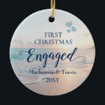 First Christmas Engaged Beach Sunset Ceramic Ornam Ceramic Ornament<br><div class="desc">Keepsake Engagement Ornament with a romantic beach sunset or sunrise over a tropical ocean with turquoise teal blue waves and pink peach sand shoreline with beautiful pastel colors is perfect for the couple who got engaged on a beach or are planning a destination wedding.</div>