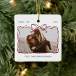 First Christmas Engaged Burgundy Bow Frame Ceramic Ornament<br><div class="desc">Introducing the perfect Christmas ornament for the soon to be Mr and Mrs! This customizable ornament is the perfect way to celebrate your first Christmas together as an engaged couple. With a whimsical burgundy bow frame design and handwritten font, this ornament will look stunning on your tree. The best part?...</div>