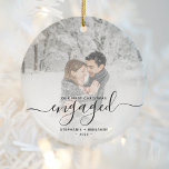 First Christmas Engaged Custom Photo Black Script Ceramic Ornament<br><div class="desc">Commemorate your engagement with this beautiful modern keepsake ornament. The black text reads "Our first Christmas engaged, " with the word "engaged" in elegant handwriting script with flourishes before and after. Replace the sample image with your favorite photo, and add your names and the year. A white gradient filter helps...</div>