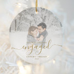 First Christmas Engaged Custom Photo Gold Script Ceramic Ornament<br><div class="desc">Commemorate your engagement with this beautiful modern keepsake ornament. The gold-colored text reads "Our first Christmas engaged, " with the word "engaged" in elegant faux foil handwriting script with flourishes before and after. Replace the sample image with your favorite photo, and add your names and the year. A white gradient...</div>