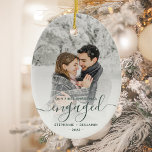 First Christmas Engaged Custom Photo Green Script Ceramic Ornament<br><div class="desc">Commemorate your engagement with this beautiful modern keepsake ornament. The dark green text reads "Our first Christmas engaged, " with the word "engaged" in elegant handwriting script with flourishes before and after. Replace the sample image with your favorite photo, and add your names and the year. A white gradient filter...</div>
