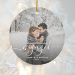 First Christmas Engaged Custom Photo White Script Ceramic Ornament<br><div class="desc">Commemorate your engagement with this beautiful modern keepsake ornament. The white text reads "Our first Christmas engaged, " with the word "engaged" in elegant handwriting script with flourishes before and after. Replace the sample image with your favorite photo, and add your names and the year. A dark gradient filter helps...</div>