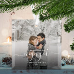 First Christmas Engaged Custom Photo White Script Glass Ornament<br><div class="desc">Commemorate your engagement with this beautiful modern keepsake ornament. The white text reads "Our first Christmas engaged, " with the word "engaged" in elegant handwriting script with flourishes before and after. Replace the sample image with your favorite photo, and add your names and the year. A dark gradient filter helps...</div>