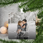 First Christmas Engaged Custom Photo White Script Metal Ornament<br><div class="desc">Commemorate your engagement with this beautiful modern keepsake ornament. The white text reads "Our first Christmas engaged, " with the word "engaged" in elegant handwriting script with flourishes before and after. Replace the sample image with your favorite photo, and add your names and the year. A black gradient filter helps...</div>