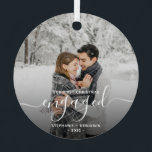 First Christmas Engaged Custom Photo White Script Metal Ornament<br><div class="desc">Commemorate your engagement with this beautiful modern keepsake ornament. The white text reads "Our first Christmas engaged, " with the word "engaged" in elegant handwriting script with flourishes before and after. Replace the sample image with your favorite photo, and add your names and the year. A dark gradient filter helps...</div>