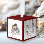 First Christmas Engaged Four Photo Red Script Cube Ornament<br><div class="desc">Commemorate your engagement with this beautiful modern keepsake ornament. The burgundy red text reads "Our first Christmas engaged, " with the word "engaged" in elegant handwriting script with flourishes before and after. The top, bottom and edges of the cube are a matching shade of red. Replace the four sample images...</div>