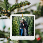 First Christmas Engaged | Minimal Engagement Photo Ceramic Ornament<br><div class="desc">A stylish minimal photo holiday christmas tree ornament with classic typography "Our first christmas engaged" in black on a clean simple minimalist white background. The photo, greeting and name can be easily customized for a personal touch. A simple, minimalist and contemporary christmas design to announce your engagement to your loved...</div>