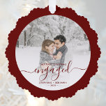 First Christmas Engaged Photo Burgundy Script Ornament Card<br><div class="desc">Commemorate your engagement with this beautiful keepsake ornament card. The burgundy text reads "Our first Christmas engaged, " with the word "engaged" in elegant handwriting script with flourishes before and after. Replace the sample image with your favorite photo, and add your names and the year. A white gradient filter helps...</div>