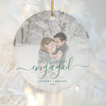 First Christmas Engaged Photo Pine Green Script Ceramic Ornament<br><div class="desc">Commemorate your engagement with this beautiful modern keepsake ornament. The pine green text reads "Our first Christmas engaged, " with the word "engaged" in elegant handwriting script with flourishes before and after. Replace the sample image with your favorite photo, and add your names and the year. A white gradient filter...</div>